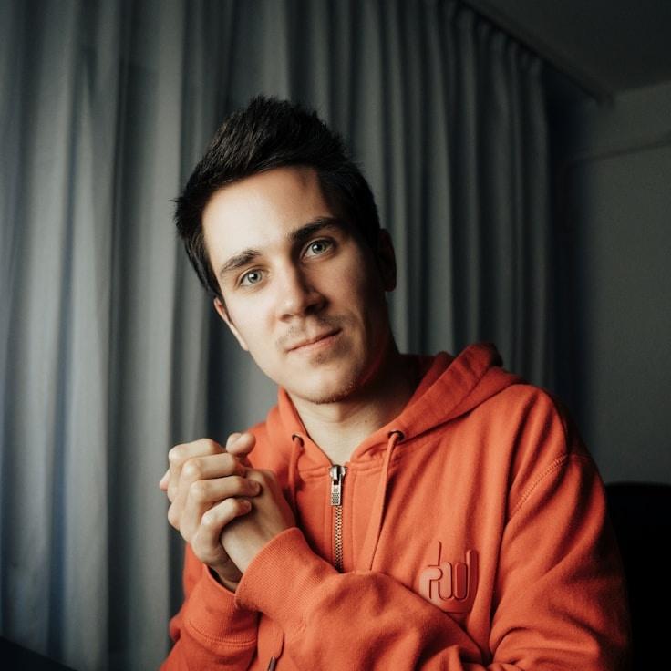 Kaveri Mehta, Lead Design Curator at TrailGroveHarvest, reviewing corporate floral arrangements